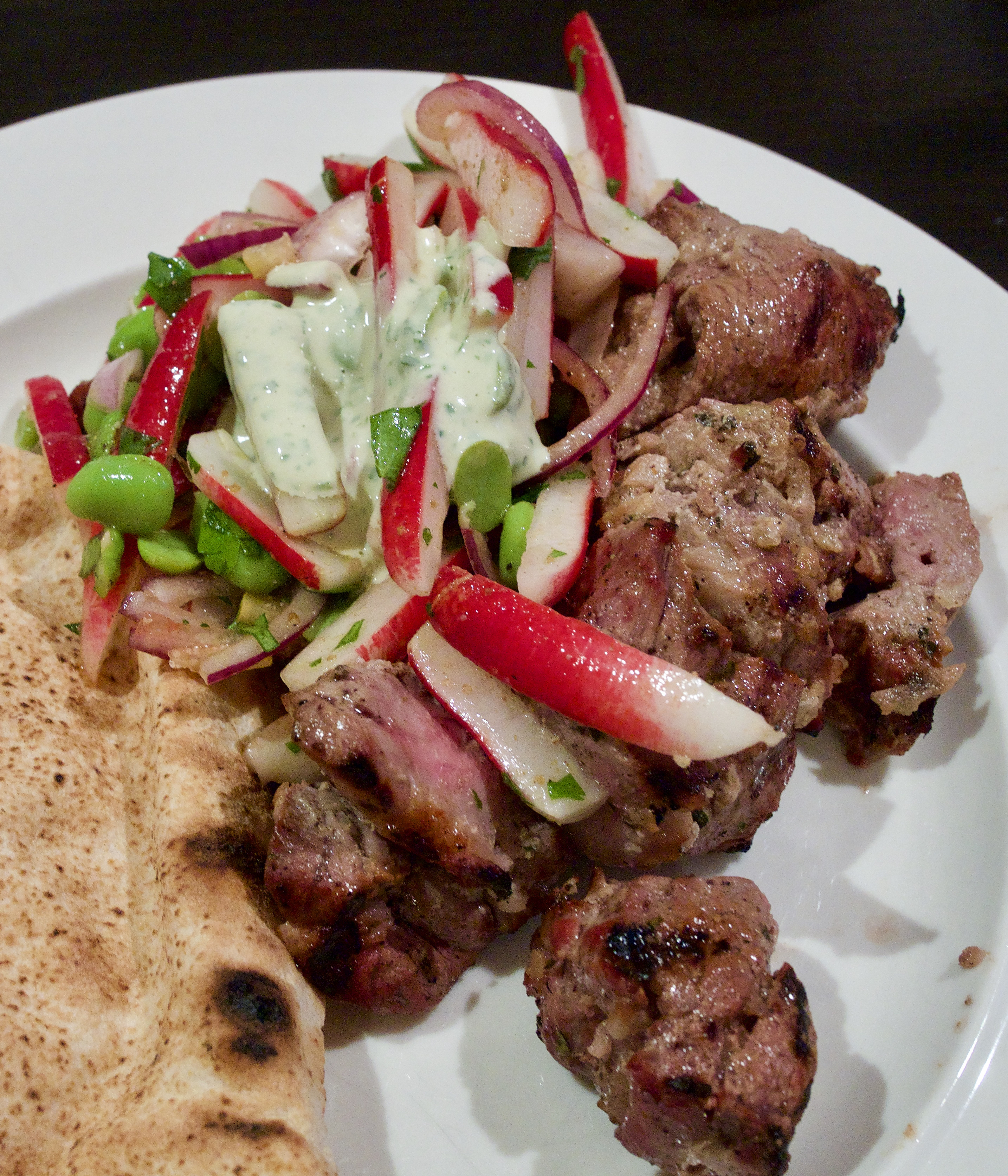 Lamb kebabs with radish salad