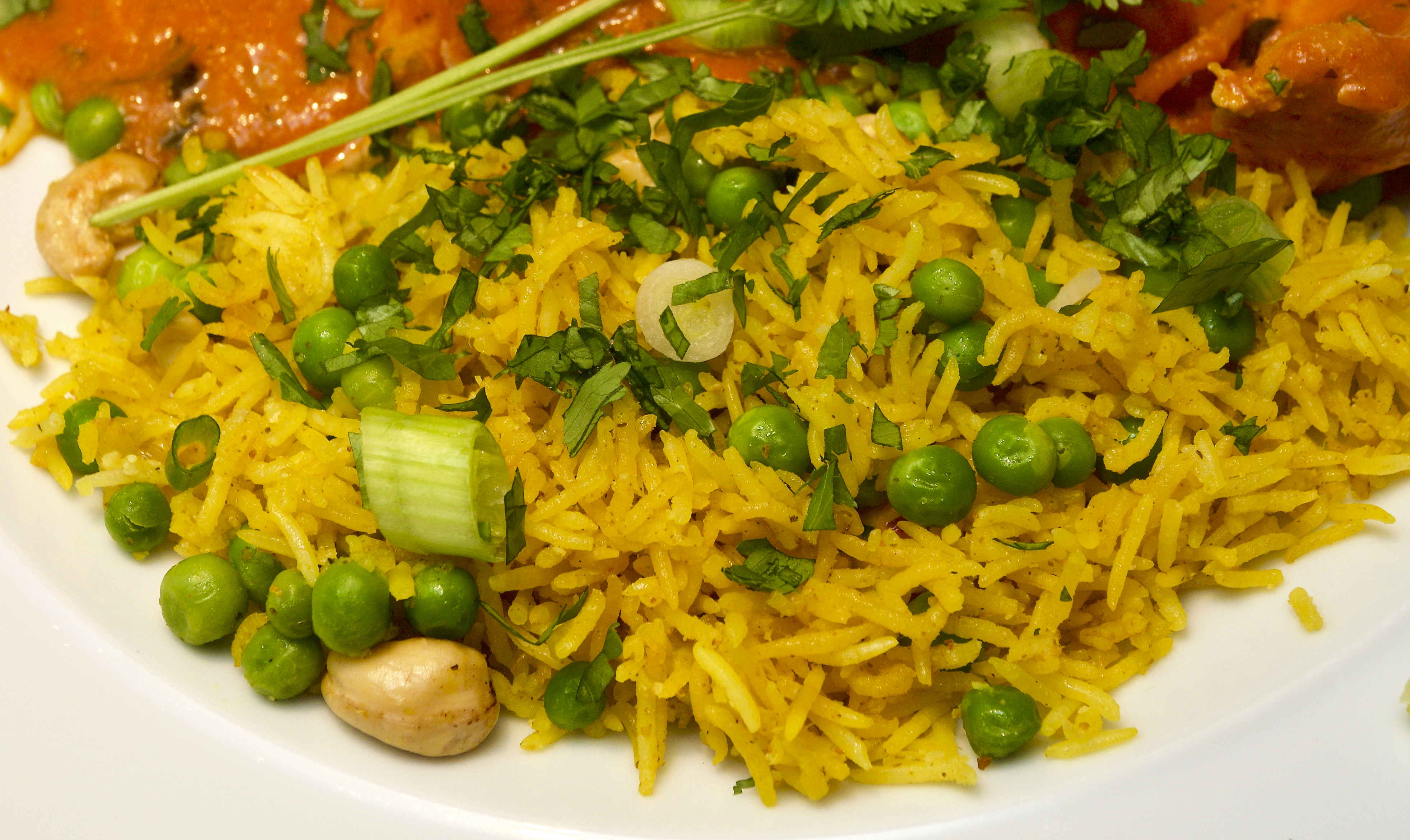 Fragrant yellow rice with cashews and peas