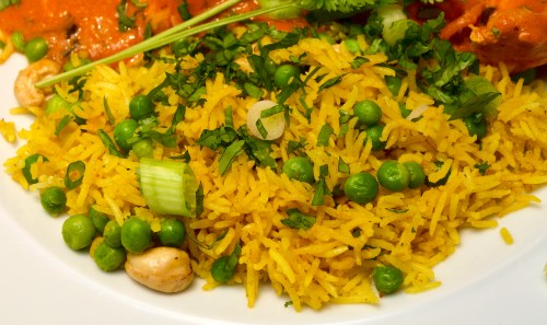 Fragrant yellow rice with cashews and peas